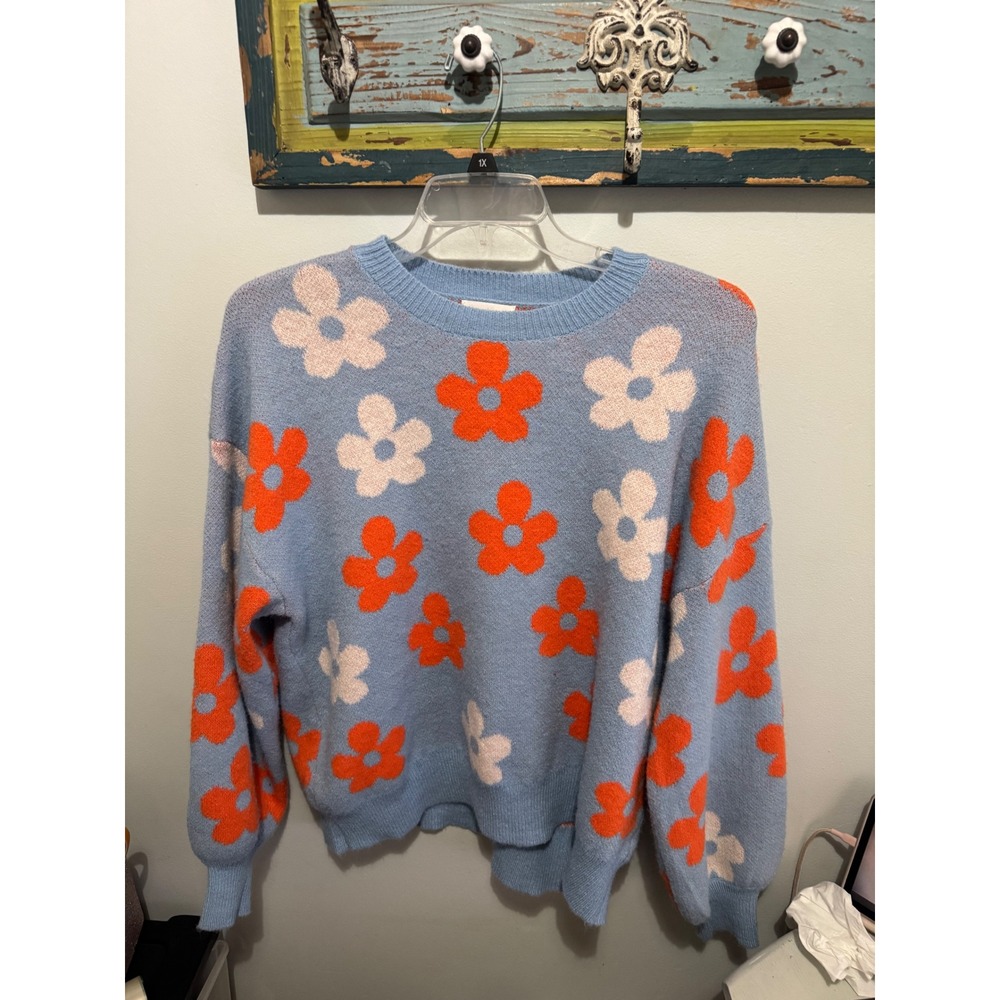 Adora Blue Sweater with orange and white flowers